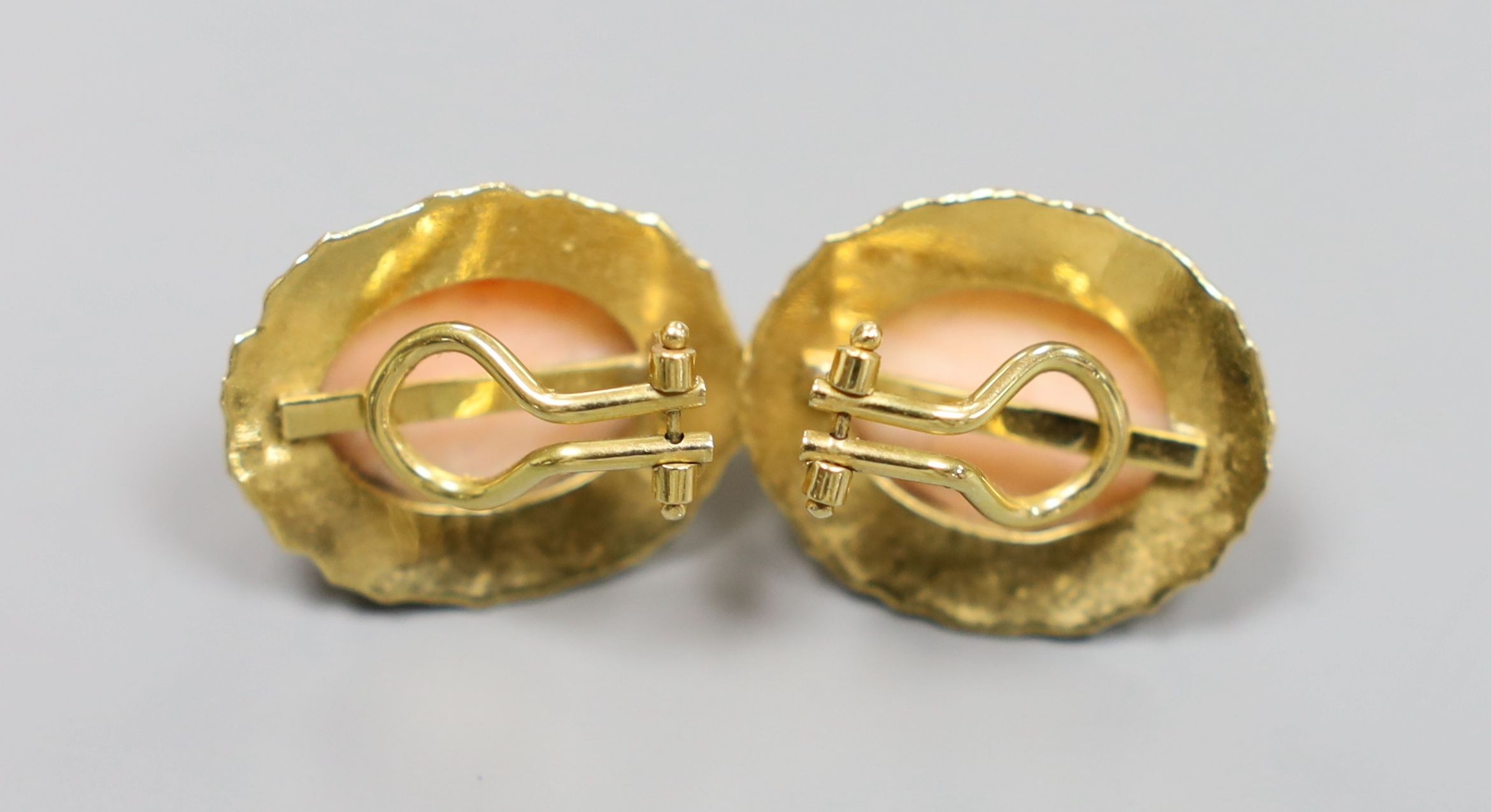 A pair of modern 750 and fluted coral bead set ear clips, 23mm, gross 10.7 grams.